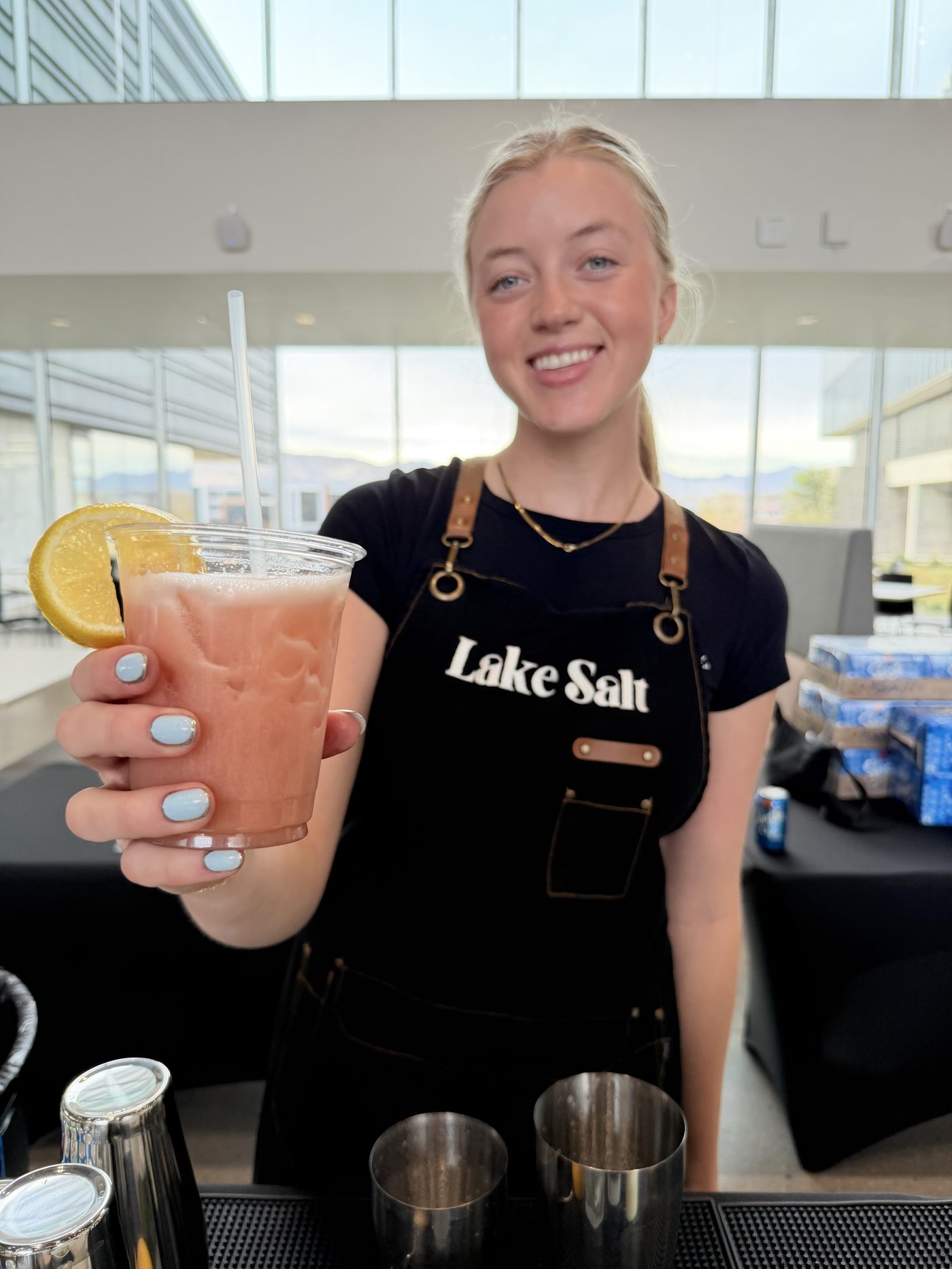 Lake Salt bartender serving signature wedding cocktail