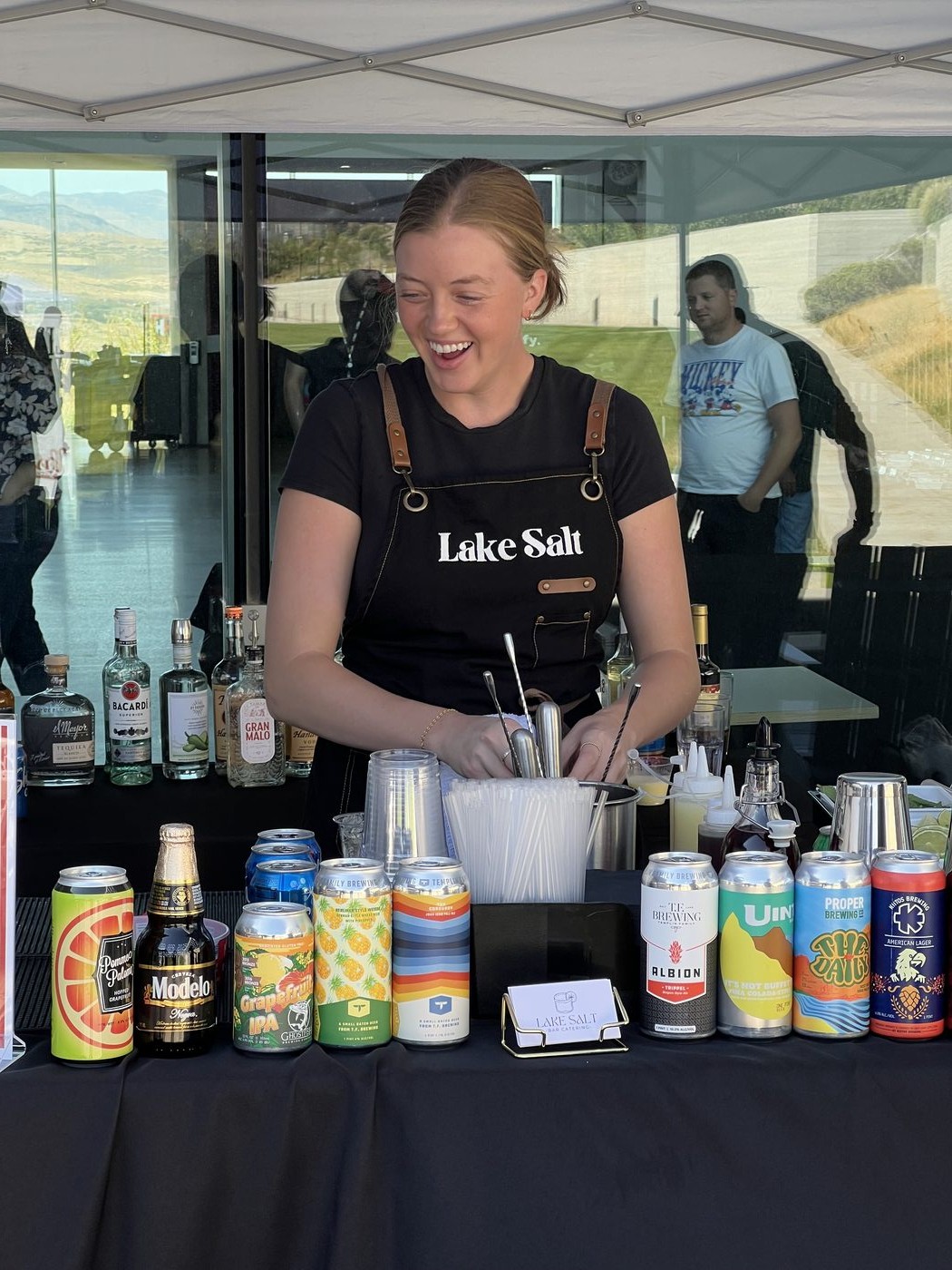 Lake Salt bartender crafting cocktails at a full bar